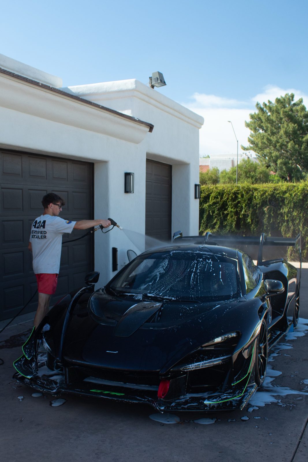 Aidan McBride, certified mobile detailer, washing a McLaren Senna in Scottsdale
